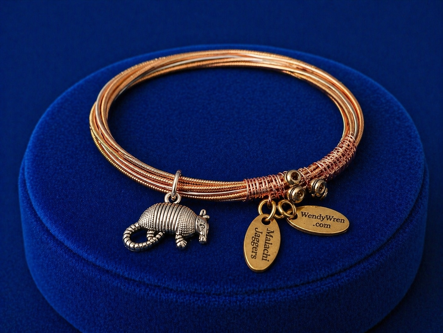 Wrapped guitar string bracelet with Armadillo charm