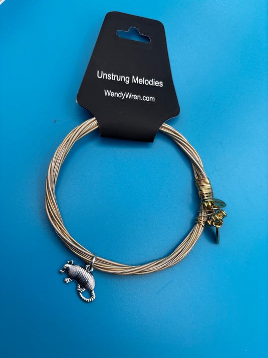 Guitar string bracelet with an Armadillo